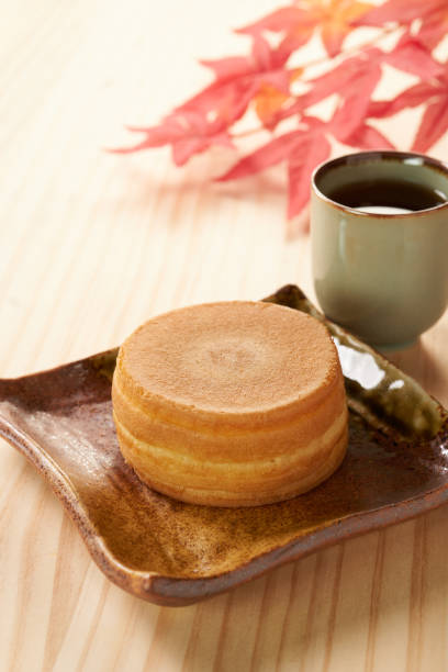 istock Wheel cake. Japanese bean paste pancake on a wooden background. 1794856861