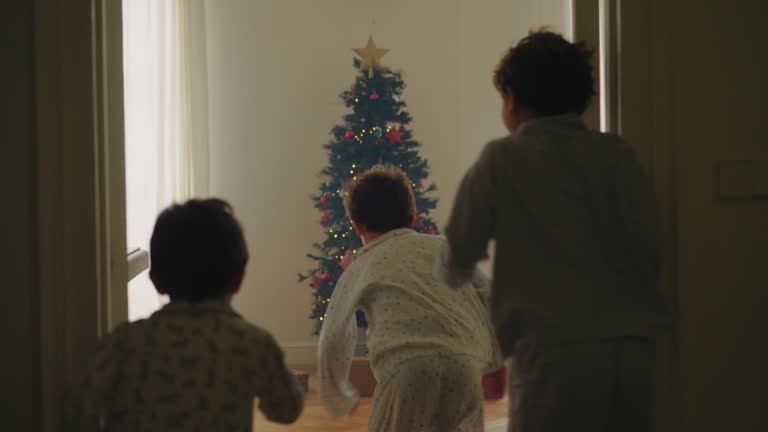 Boys opening Christmas gifts