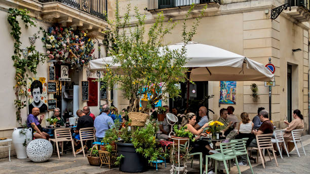 Empty tables of street restaurants on boardwalk in Malta during covid-19 coronavirus quarantine: Marsaxlokk, Malta - 29 June, 2018