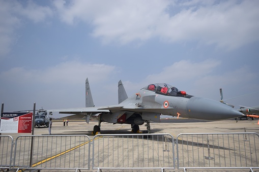 Bangalore, India – February 04, 2021: A military fighter jet parked on the tarmac of  Yelahanka, in Bengaluru, Karnataka, India