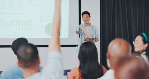 istock Presentation, question and Asian businessman in digital marketing, data analytics and research on monitor screen for audience. Hand, ideas and creative presenter for leadership and mentorship 1794895671