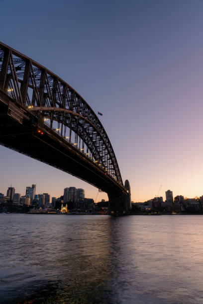 Early morning light falls upon Sydney's iconic Harbour Bridge.