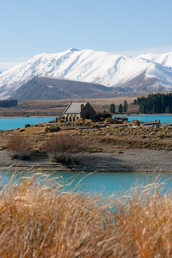 Winter sunlight falls upon the famous Church Of The Good Shepherd on the shores of Lake Tekapo, on New Zealand's South Island.