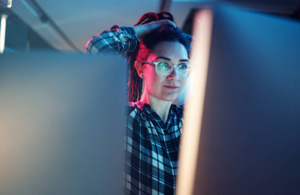 istock Cybersecurity, malware and woman hacker working on a computer in the basement at night for phishing. Database, password and ransomware with a female coder hacking a digital transformation network 1794918034