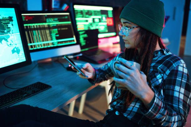 istock Mobile, cyber security or girl by computer screen in dark room at night for coding, research or blockchain. Coffee, phone hacker or woman hacking online in digital transformation on global website 1794918044
