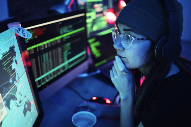 istock Woman, computer and hacker thinking with headphones and programming for cybersecurity. Music, radio podcast and female reading map for hacking, location or phishing, idea or dark web at night in home 1794918052