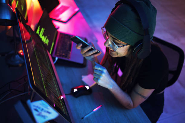 istock Night, phone call or girl hacker by computer smiling in conversations for hacking, phishing or cybersecurity. Voice note, happy woman or code for coding, digital transformation or networking online 1794918064