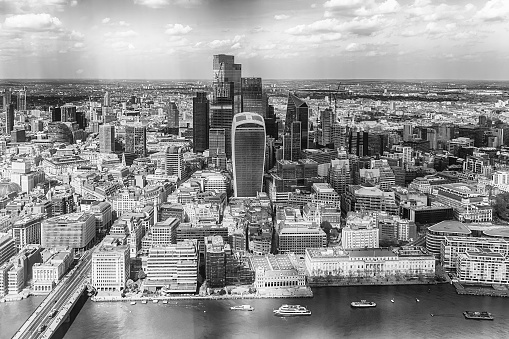 Aerial view of London skyline with St Paul Cathedral on a cloudy day.