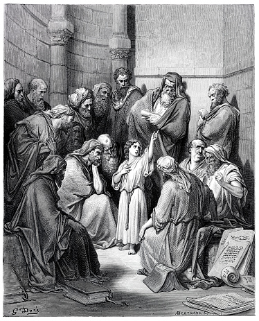 Jesus preaching in a temple speaking to doctors
Jesus was found “in the temple, sitting in the midst of the doctors, both hearing them, and asking them questions. And all that heard him were astonished at his understanding and answers” ( Luke 2:46-47 ).
Original edition from my own archives
Source : Sagrada Biblia 1884
