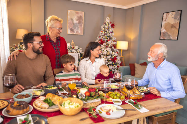 istock Happy multi-generation family having Christmas dinner at home 1794929092