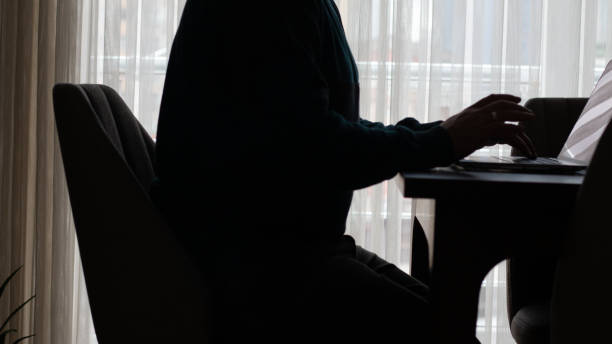istock Laptop and laptop on table near window curtains 1794956653