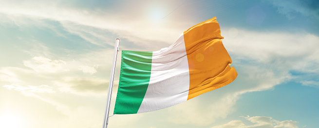 Ireland national flag waving in the beautiful sky.