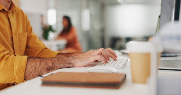 Hands, typing and person with keyboard, journalist writing article on computer at startup and creativity. Copywriting, productivity with research online, workflow and content creation at office desk