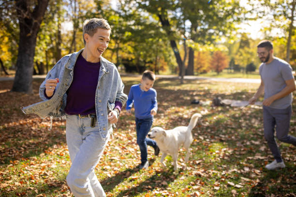 istock Family running around a park while on a picnic 1794983886