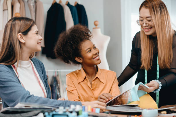 istock multi-ethnic designer group Discusses and exchange ideas for clothing design with intention and happiness. 1794985419