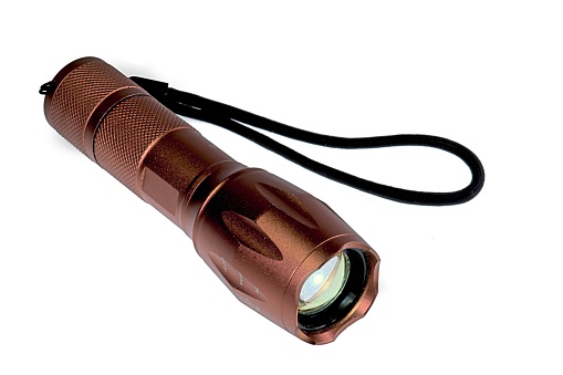 Copper Tactical Flashlight on white background
