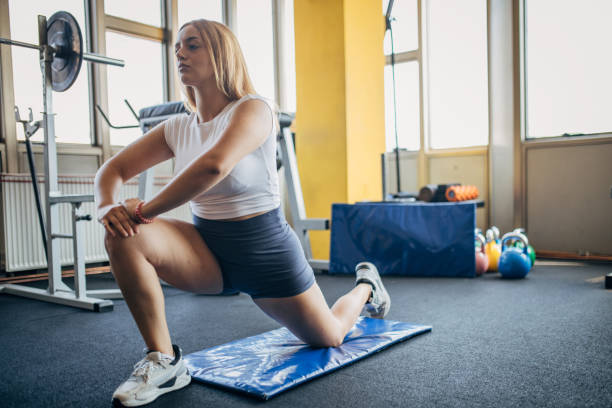 istock Woman exercising in gym 1794988912