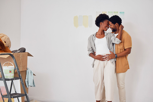Forehead, pregnancy or black couple hugging in home renovation, diy or house remodel together by apartment. Lovers, partnership or African man and pregnant woman excited about baby or new family