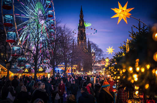 Edinburgh, Scotland - Crowds of people visiting Christmas stalls and amusement rides in Princes Street Gardens in the run-up to Christmas.