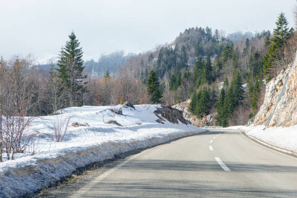 istock Winter road in the mountains 1794997649