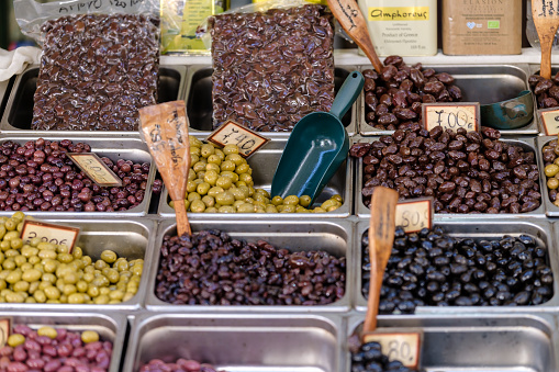 Thessaloniki, Greece - September 22, 2023 : View of various Greek Olives, olive oil and other products at the outdoor Kapani Market in Thessaloniki