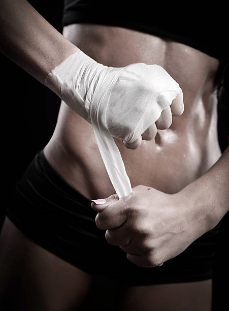 istock Female boxer wrapping hand with tape 179500390