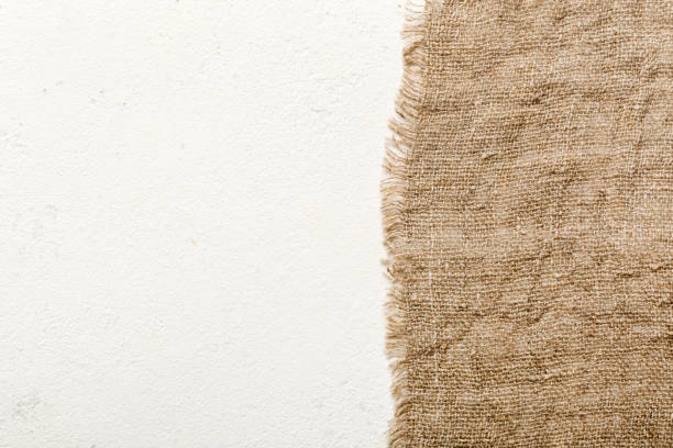istock Old burlap fabric napkin, sackcloth on table background. top view with copy space 1795005701
