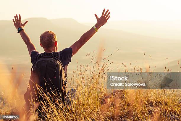 Man Greeting Golden Rising Of The Sun Stock Photo - Download Image Now - Lifestyles, Vitality, Freedom
