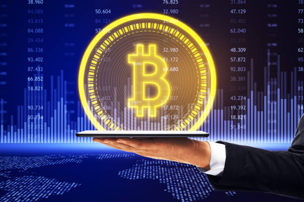 istock hand holding digital tablet with bitcoin symbol on blue digital background, cryptocurrency concept 1795015032