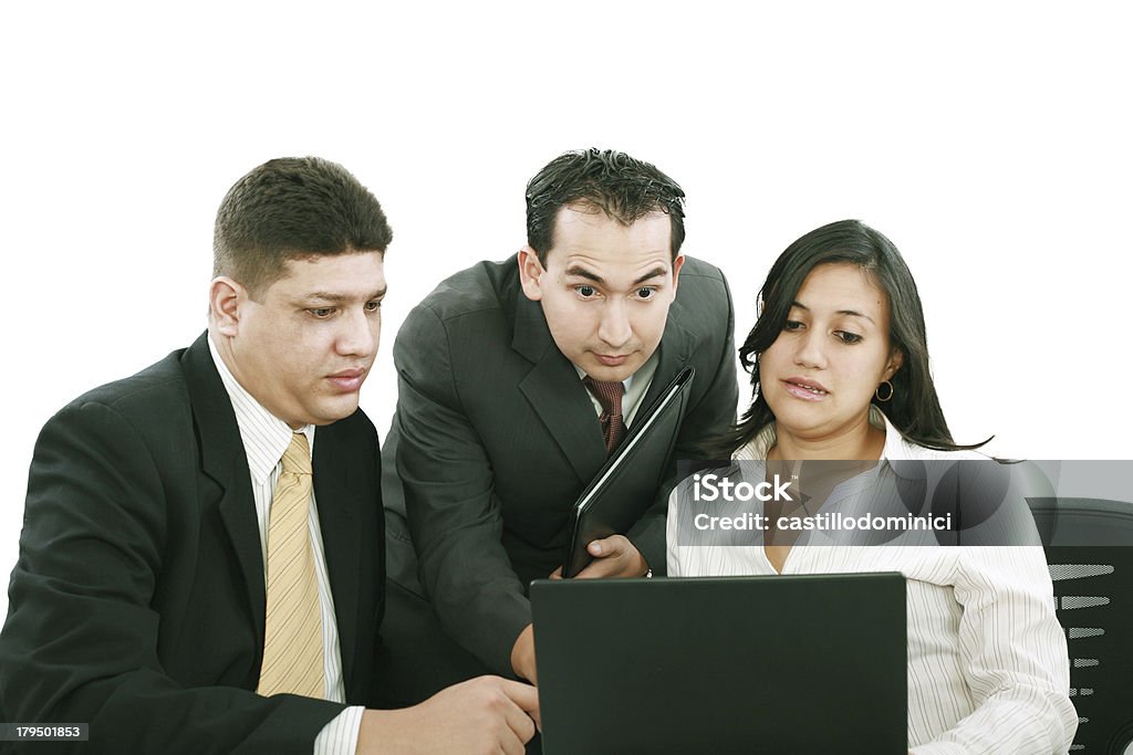 business team looking shocked and worried business team looking shocked and worried when looking at the laptop computer on the table Accidents and Disasters Stock Photo