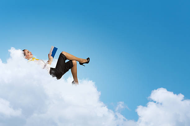 istock Businesswoman lying on clouds 179503934