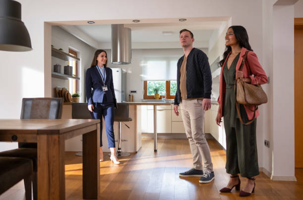 istock Estate Agent Talking With Potential Buyers 1795043603