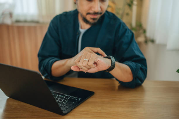 istock Businessman using smartwatch while working at office,man touching on smartwatch screen 1795048156