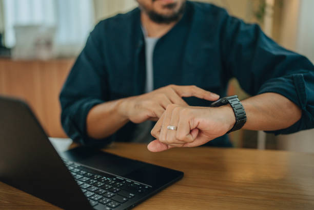 istock Businessman using smartwatch while working at office,man touching on smartwatch screen 1795049746