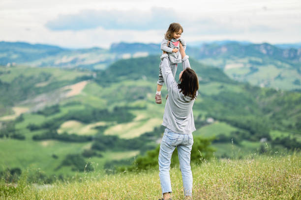 istock family having fun in a green meadow. 1795055275