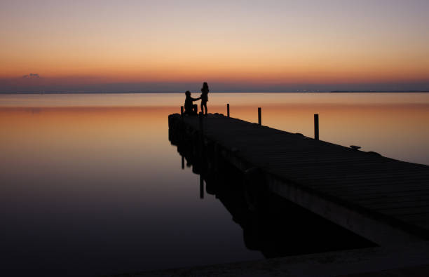 istock Romantic couple on pier 1795056895