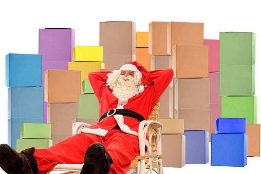 Santa Claus with packages on white background