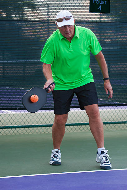 istock Pickleball Action - Senior Man Returning Serve 179507298