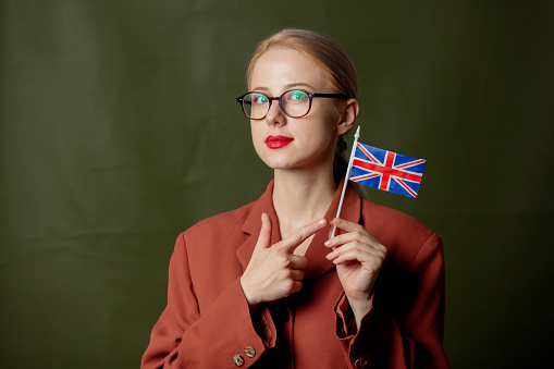 Stylish woman in glasses with Great Britain flag