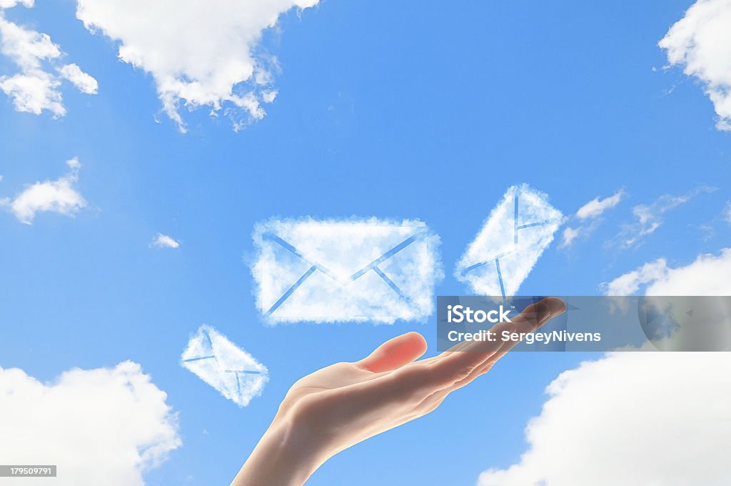 Close up of hand with envelope symbols Close up of hand with envelope symbols. E-mail concept Envelope Stock Photo