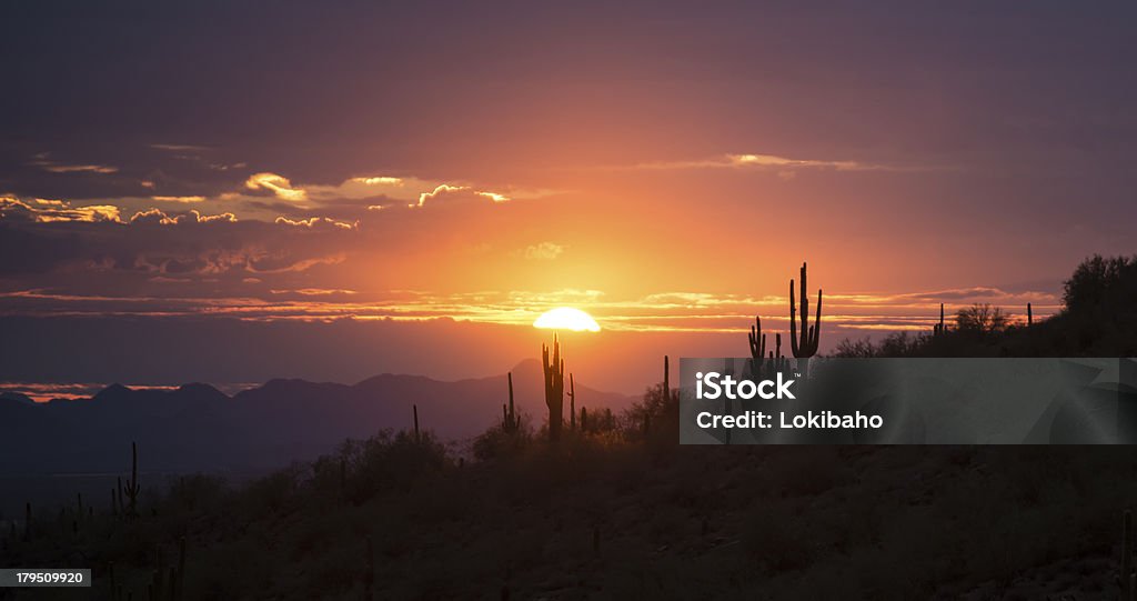 Beautiful Desert Hills Sunset Beautiful colorful Arizona sunset Sunset Stock Photo