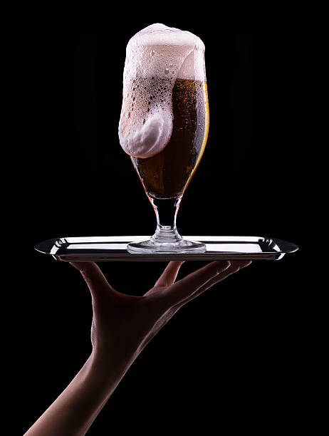istock Frosty glass of light beer on black background 179509983