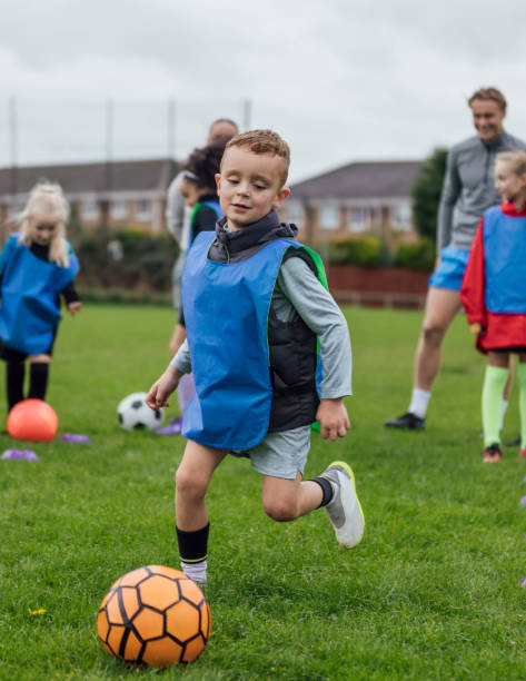 istock Dribbling the Ball at Football Training 1795103611