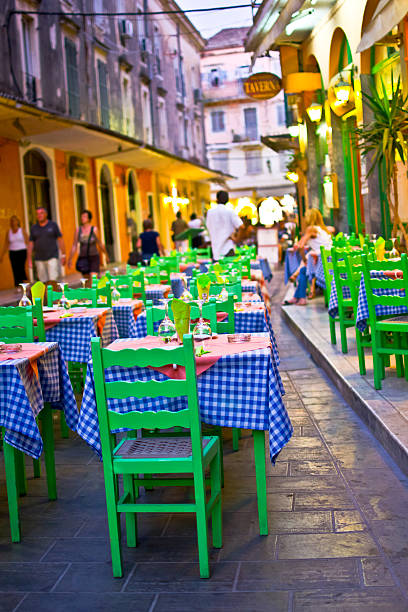 istock Old street and restaurant tables in corfu greece 179510714