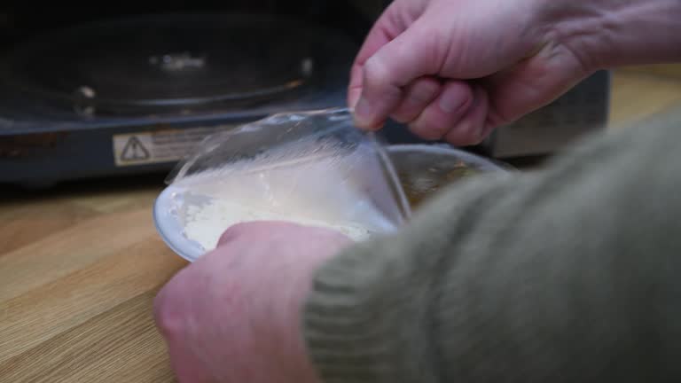 Peeling a film lid off a ready meal