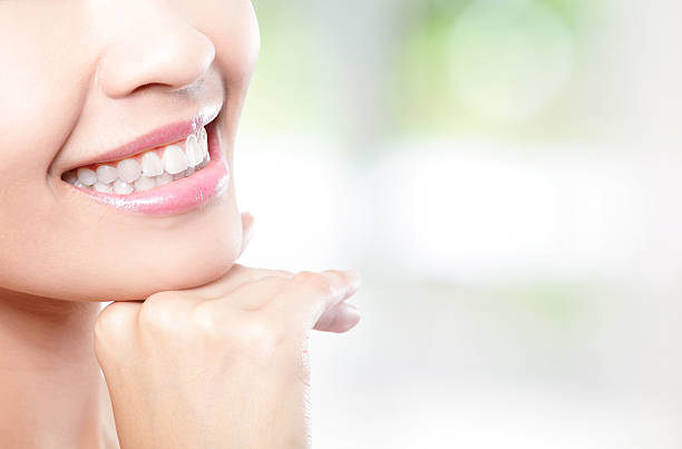 istock Beautiful young woman teeth close up 179511464