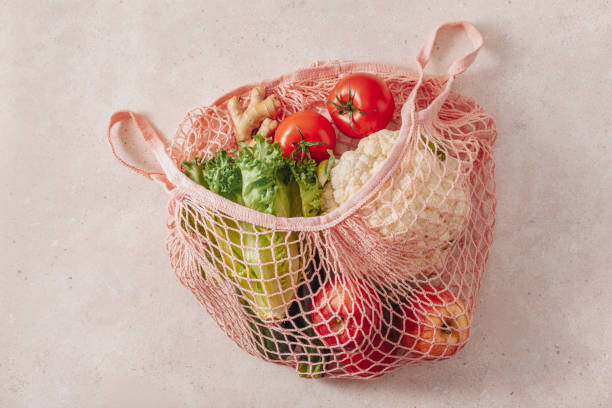 istock fruits vegetables in reusable mesh cotton bag, plastic free zero waste concept 1795129425