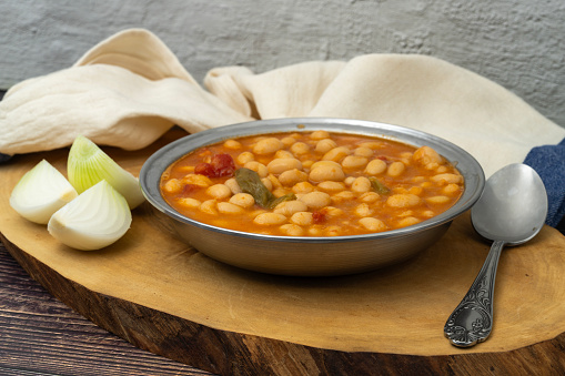Meaty baked beans dish on a retro silver plate.