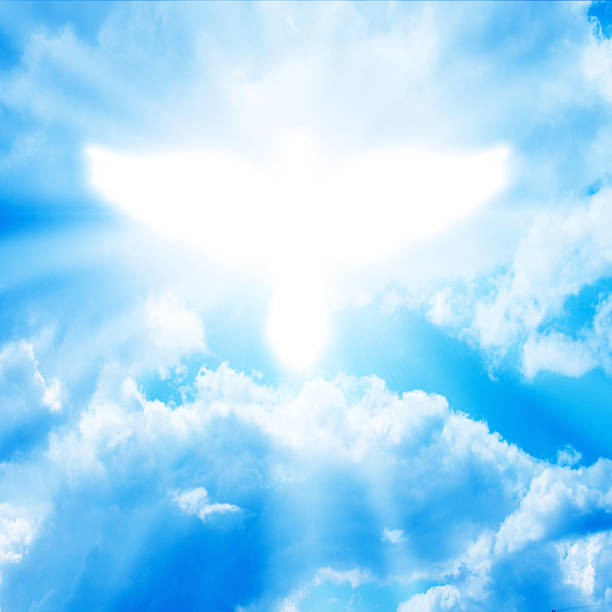 istock glowing dove in a blue sky 179513602