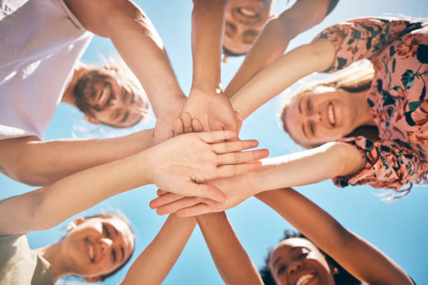 istock Support,love and friends hands connect for collaboration, teamwork and agreement together outdoor against blue sky background. Diversity, support and community with unity, faith and trust in nature 1795138597
